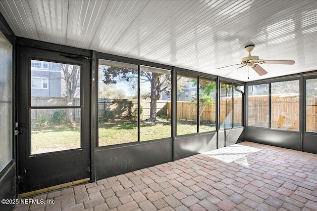 14319 Cedar Island Rd N, Jacksonville, FL 32250 - unfurnished sunroom with ceiling fan and a wealth of natural light