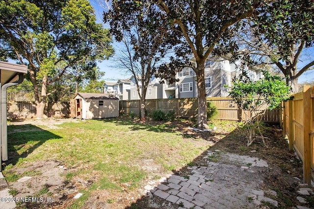 14319 Cedar Island Rd N, Jacksonville, FL 32250 - view of yard featuring a fenced backyard, an outdoor structure, and a shed
