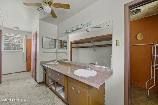 2685 Sandra Ln, Jacksonville, FL 32208 - bathroom with ceiling fan, double vanity, and a sink