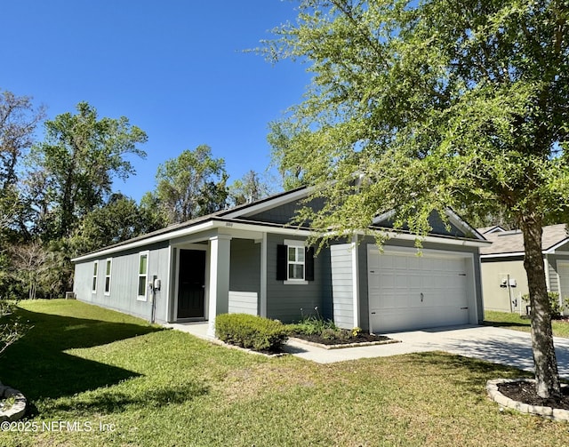 view of front of home with concrete driveway, a front yard, and a garage