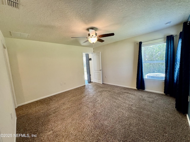 carpeted empty room featuring visible vents, baseboards, a textured ceiling, and ceiling fan