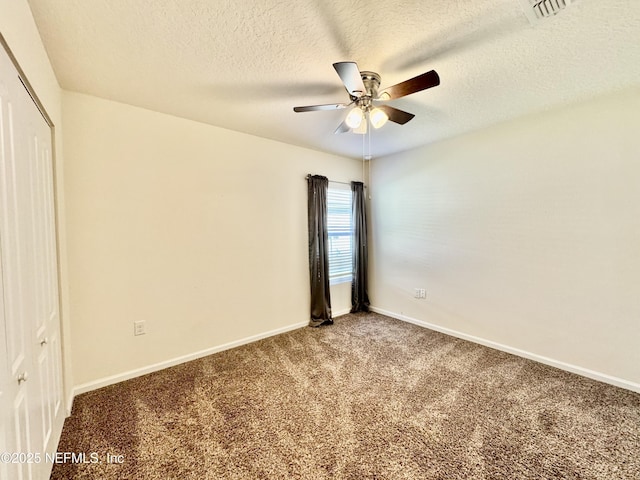unfurnished bedroom with a closet, baseboards, visible vents, and carpet flooring