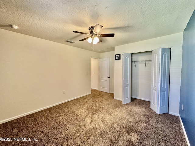 unfurnished bedroom featuring visible vents, a ceiling fan, a closet, carpet floors, and baseboards
