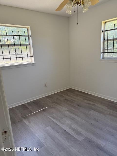 9504 Flechette Ave, Jacksonville, FL 32208 - unfurnished room featuring wood finished floors, baseboards, and ceiling fan