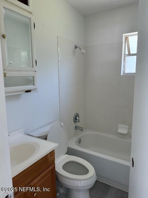 9504 Flechette Ave, Jacksonville, FL 32208 - bathroom featuring tub / shower combination, toilet, and vanity