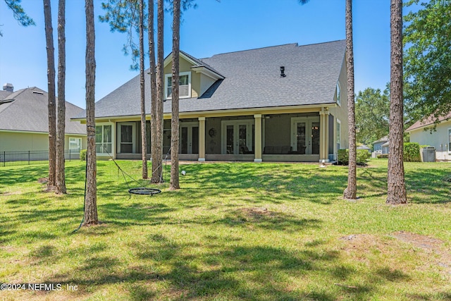 1741 Wild Dunes Cir, Orange Park, FL 32065 - rear view of house featuring fence, roof with shingles, a yard, stucco siding, and french doors