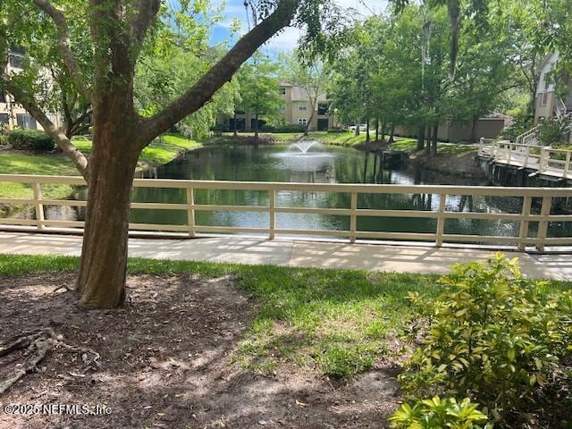 view of home's community with a water view
