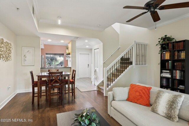 9745 Touchton Rd Unit 1629, Jacksonville, FL 32246 - living area featuring crown molding, ceiling fan, baseboards, and dark wood-type flooring