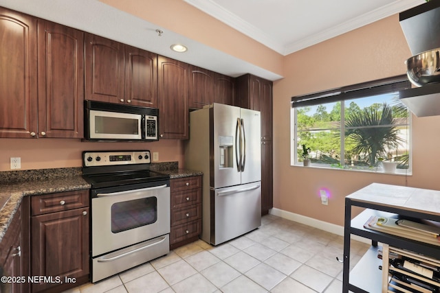 9745 Touchton Rd Unit 1629, Jacksonville, FL 32246 - kitchen featuring baseboards, dark brown cabinetry, crown molding, stainless steel appliances, and light tile patterned flooring