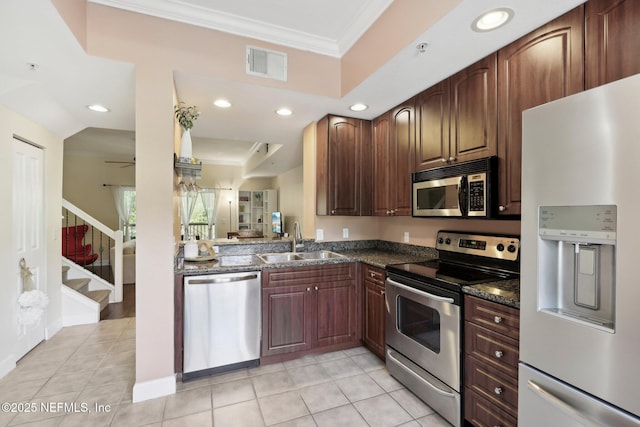 9745 Touchton Rd Unit 1629, Jacksonville, FL 32246 - kitchen featuring crown molding, visible vents, dark stone countertops, appliances with stainless steel finishes, and a sink