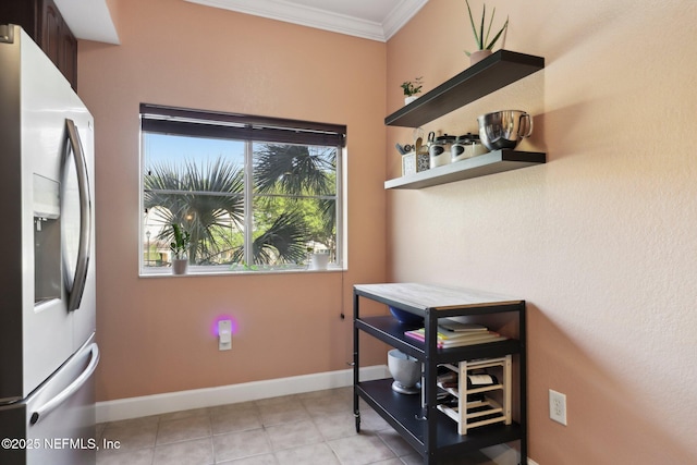 9745 Touchton Rd Unit 1629, Jacksonville, FL 32246 - interior space with light tile patterned floors, baseboards, crown molding, and stainless steel fridge