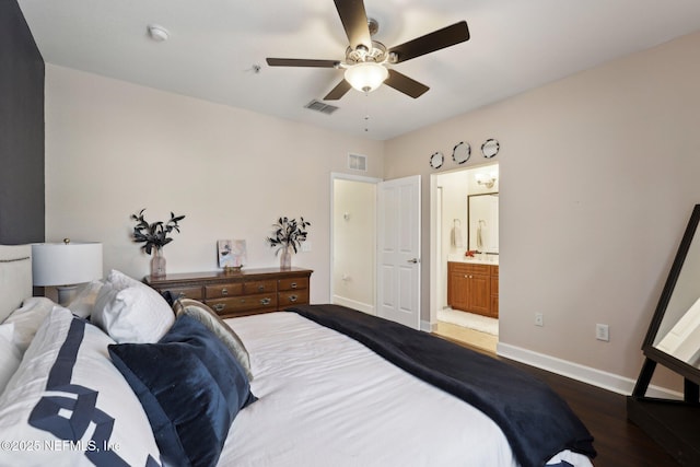 9745 Touchton Rd Unit 1629, Jacksonville, FL 32246 - bedroom with wood finished floors, ensuite bathroom, baseboards, and visible vents