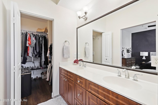 9745 Touchton Rd Unit 1629, Jacksonville, FL 32246 - full bath featuring a sink, a walk in closet, double vanity, and wood finished floors