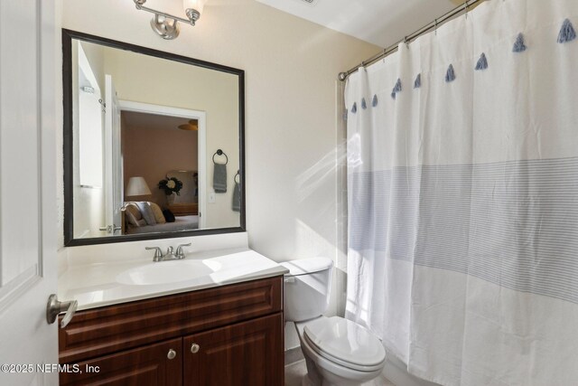9745 Touchton Rd Unit 1629, Jacksonville, FL 32246 - bathroom with a shower with shower curtain, ensuite bath, vanity, and toilet