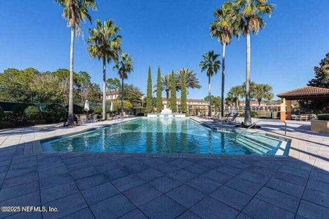 9745 Touchton Rd Unit 1629, Jacksonville, FL 32246 - community pool featuring a patio area