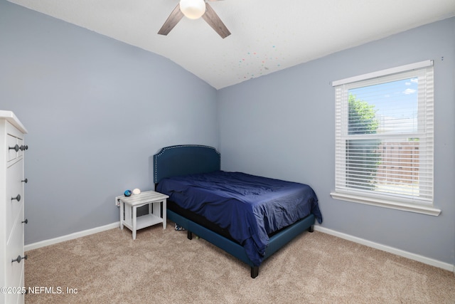 bedroom featuring baseboards, carpet flooring, ceiling fan, and lofted ceiling