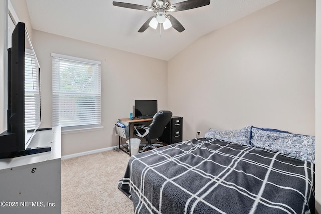 carpeted bedroom with baseboards, a ceiling fan, and vaulted ceiling