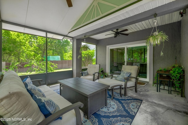 sunroom / solarium featuring ceiling fan, plenty of natural light, and an outdoor hangout area