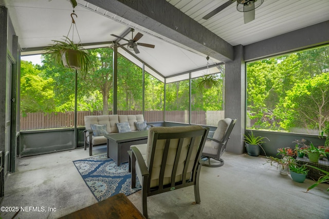 sunroom featuring a ceiling fan and an outdoor hangout area