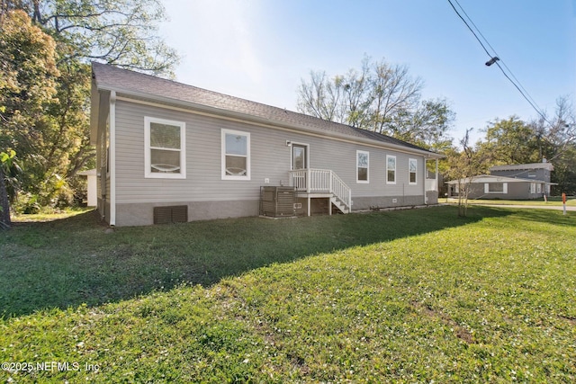 2939 Fitzgerald St, Jacksonville, FL 32254 - back of house with a lawn and crawl space