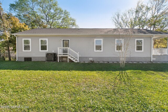 2939 Fitzgerald St, Jacksonville, FL 32254 - back of house with cooling unit and a yard