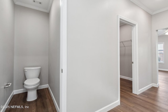 2939 Fitzgerald St, Jacksonville, FL 32254 - bathroom featuring baseboards, crown molding, wood finished floors, and toilet