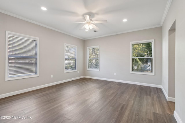 2939 Fitzgerald St, Jacksonville, FL 32254 - spare room featuring dark wood-style flooring, crown molding, baseboards, ceiling fan, and recessed lighting