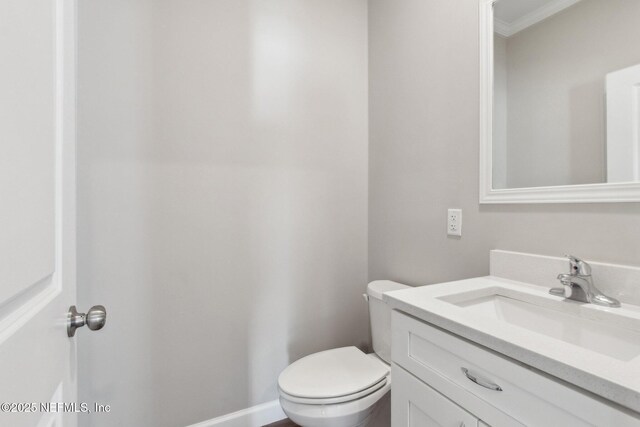 2939 Fitzgerald St, Jacksonville, FL 32254 - bathroom featuring toilet, vanity, and baseboards