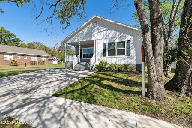 2939 Fitzgerald St, Jacksonville, FL 32254 - view of front of home featuring a front lawn and covered porch