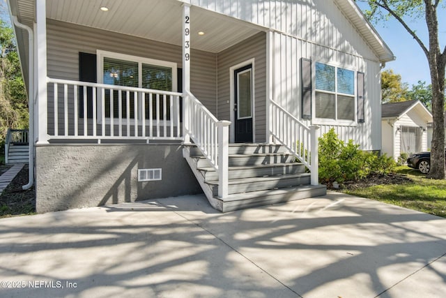 2939 Fitzgerald St, Jacksonville, FL 32254 - entrance to property with a porch and visible vents