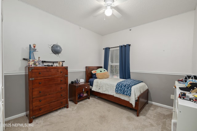 bedroom featuring carpet, baseboards, and a ceiling fan