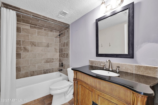 2200 Ocean Dr Unit 4A, Jacksonville Beach, FL 32050 - full bath featuring vanity, toilet, a textured ceiling, tile patterned floors, and shower / bath combo