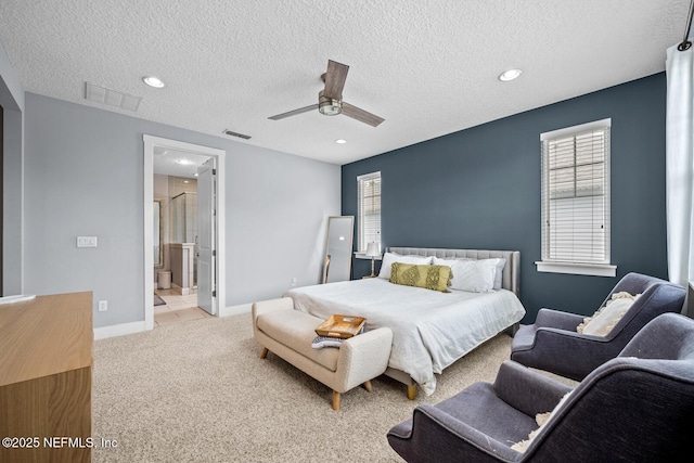bedroom featuring carpet flooring, a textured ceiling, visible vents, baseboards, and ceiling fan
