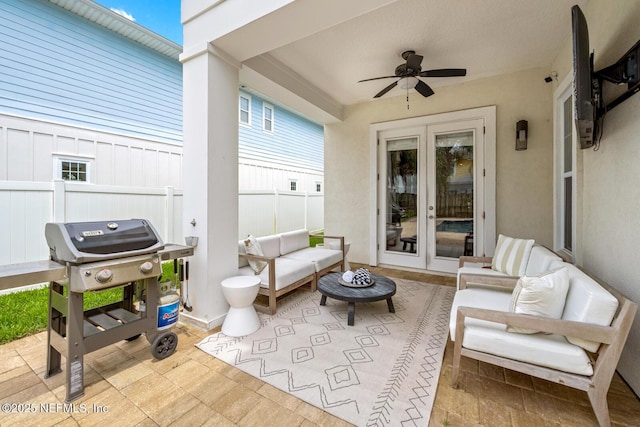 view of patio featuring an outdoor living space, french doors, a ceiling fan, fence, and grilling area