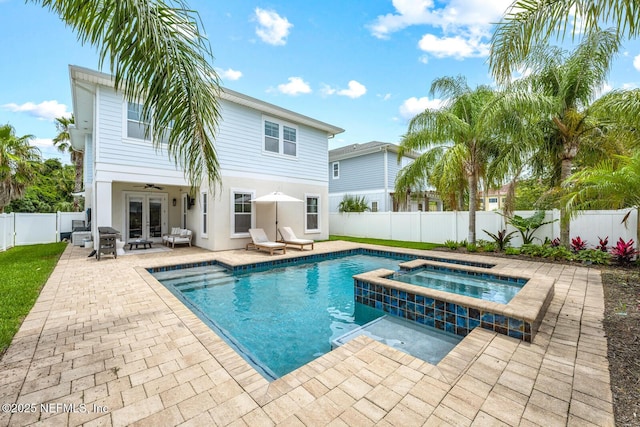 view of swimming pool with french doors, a ceiling fan, area for grilling, a fenced backyard, and a patio