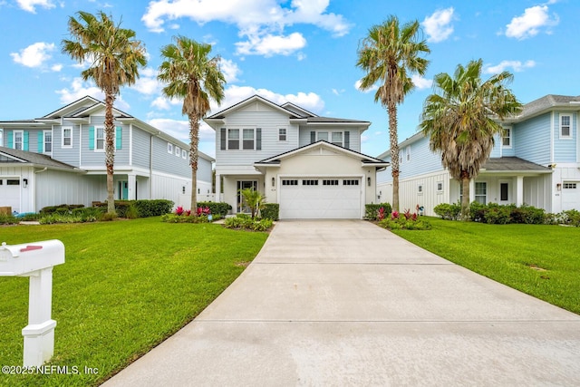 view of front of property with a front yard, driveway, and a garage