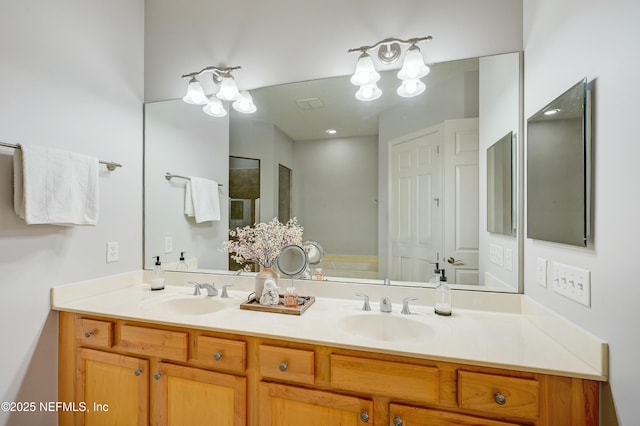 96064 Bottlebrush Ln, Fernandina Beach, FL 32034 - bathroom featuring a sink, a notable chandelier, a shower stall, and double vanity