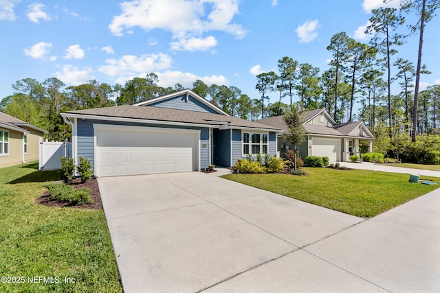 208 Seville Pkwy, Saint Augustine, FL 32086 - ranch-style home featuring a front lawn, fence, driveway, and an attached garage