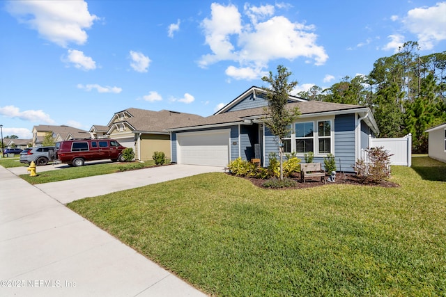 208 Seville Pkwy, Saint Augustine, FL 32086 - view of front of property featuring an attached garage, fence, concrete driveway, and a front yard
