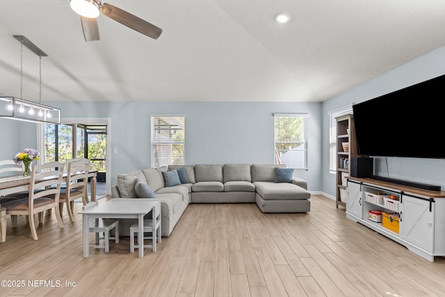 208 Seville Pkwy, Saint Augustine, FL 32086 - living area featuring baseboards, a ceiling fan, and light wood finished floors