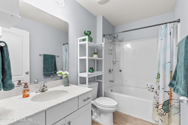 208 Seville Pkwy, Saint Augustine, FL 32086 - bathroom featuring a textured ceiling, wood finished floors, toilet, vanity, and shower / tub combo