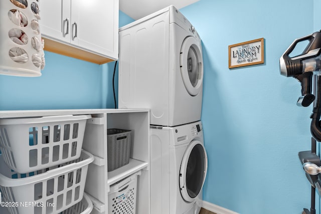 208 Seville Pkwy, Saint Augustine, FL 32086 - laundry area featuring stacked washer and dryer and cabinet space