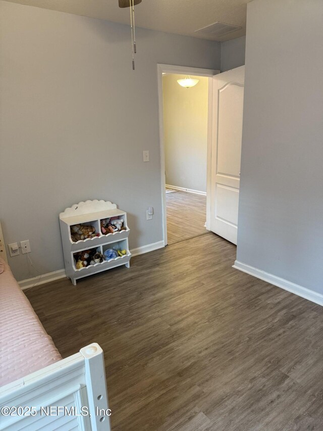 208 Seville Pkwy, Saint Augustine, FL 32086 - bedroom featuring wood finished floors and baseboards