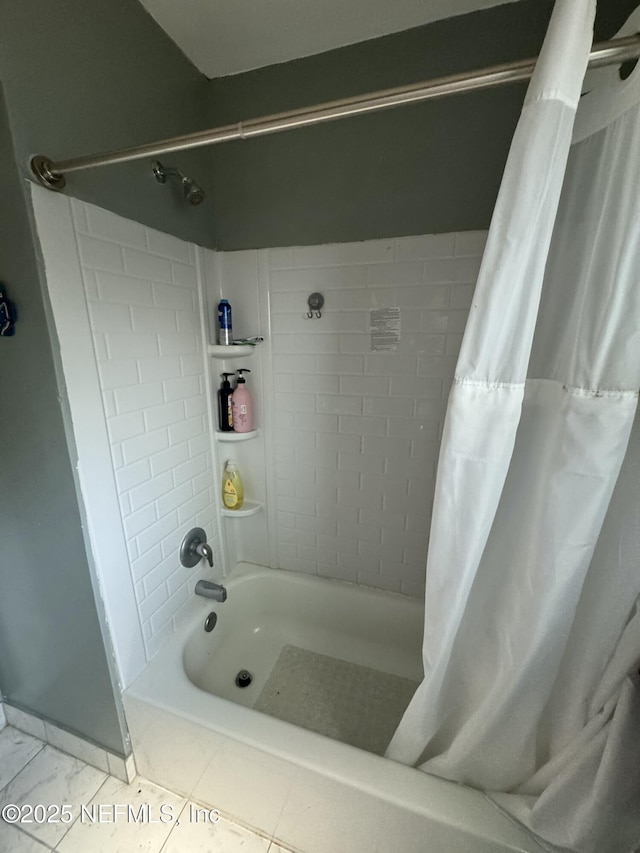 full bath with tile patterned floors and shower / bathtub combination with curtain