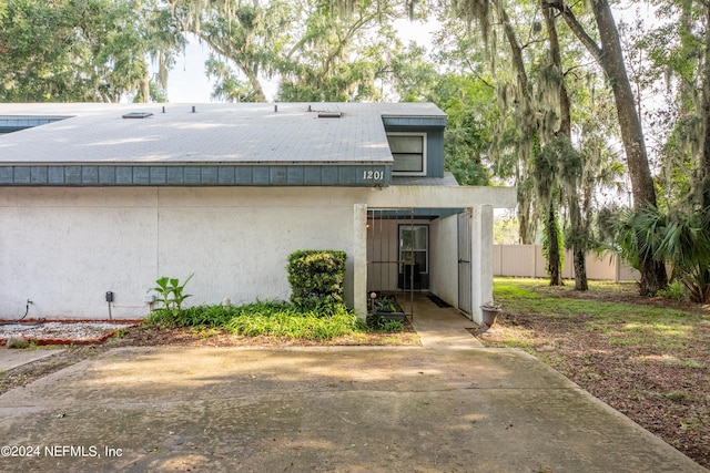 1201 Mayport Landing Cir, Jacksonville, FL 32233 - back of house with fence and stucco siding