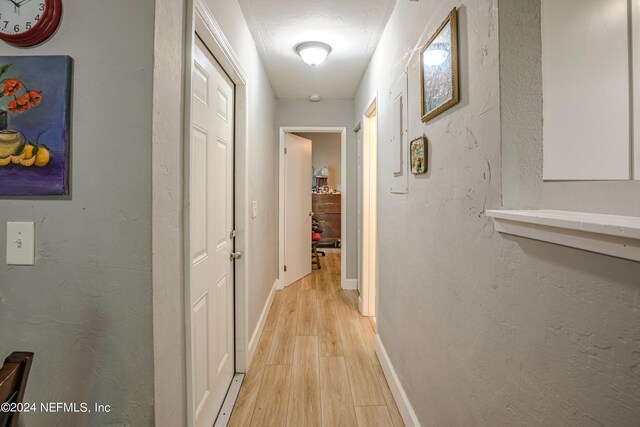 1201 Mayport Landing Cir, Jacksonville, FL 32233 - hall with light wood-type flooring, baseboards, and a textured wall