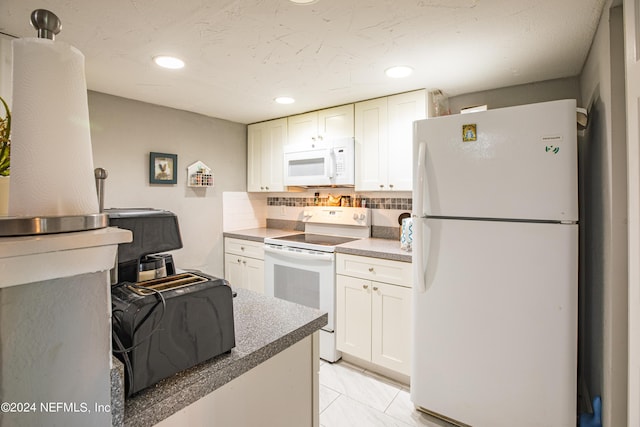 1201 Mayport Landing Cir, Jacksonville, FL 32233 - kitchen with a toaster, decorative backsplash, recessed lighting, white cabinets, and white appliances