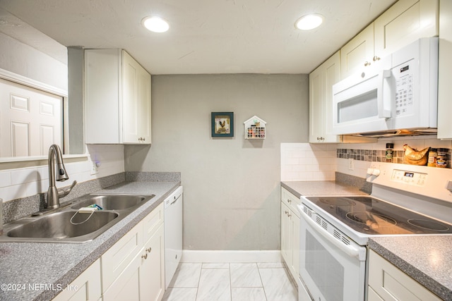 1201 Mayport Landing Cir, Jacksonville, FL 32233 - kitchen with white appliances, a sink, white cabinetry, marble finish floor, and backsplash