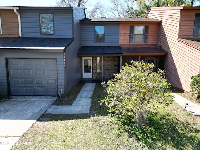 11726 Tanager Dr, Jacksonville, FL 32225 - townhome / multi-family property with a garage, driveway, and roof with shingles