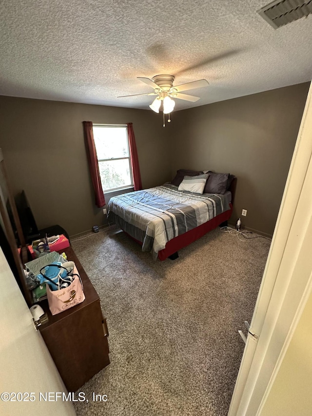 11726 Tanager Dr, Jacksonville, FL 32225 - carpeted bedroom featuring visible vents, baseboards, a textured ceiling, and a ceiling fan